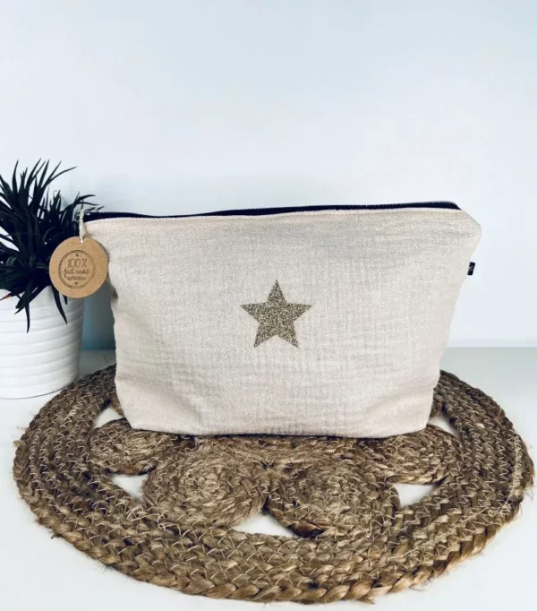 Trousse de toilette Midnight en gaze de coton blanc cassé avec étoile pailletée.
