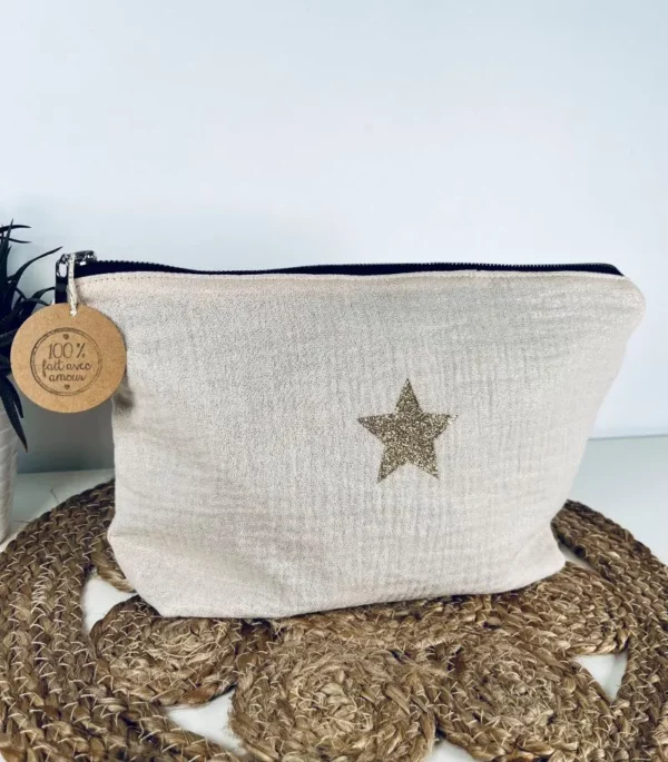 Trousse de toilette Midnight en gaze de coton blanc cassé avec étoile pailletée.