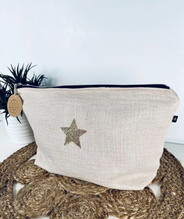 Trousse de toilette Midnight en gaze de coton blanc cassé avec étoile pailletée.