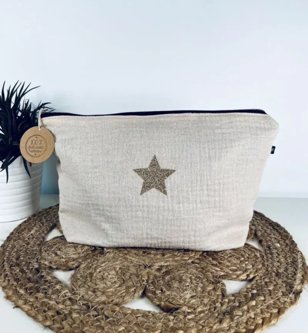 Trousse de toilette Midnight en gaze de coton blanc cassé avec étoile pailletée.